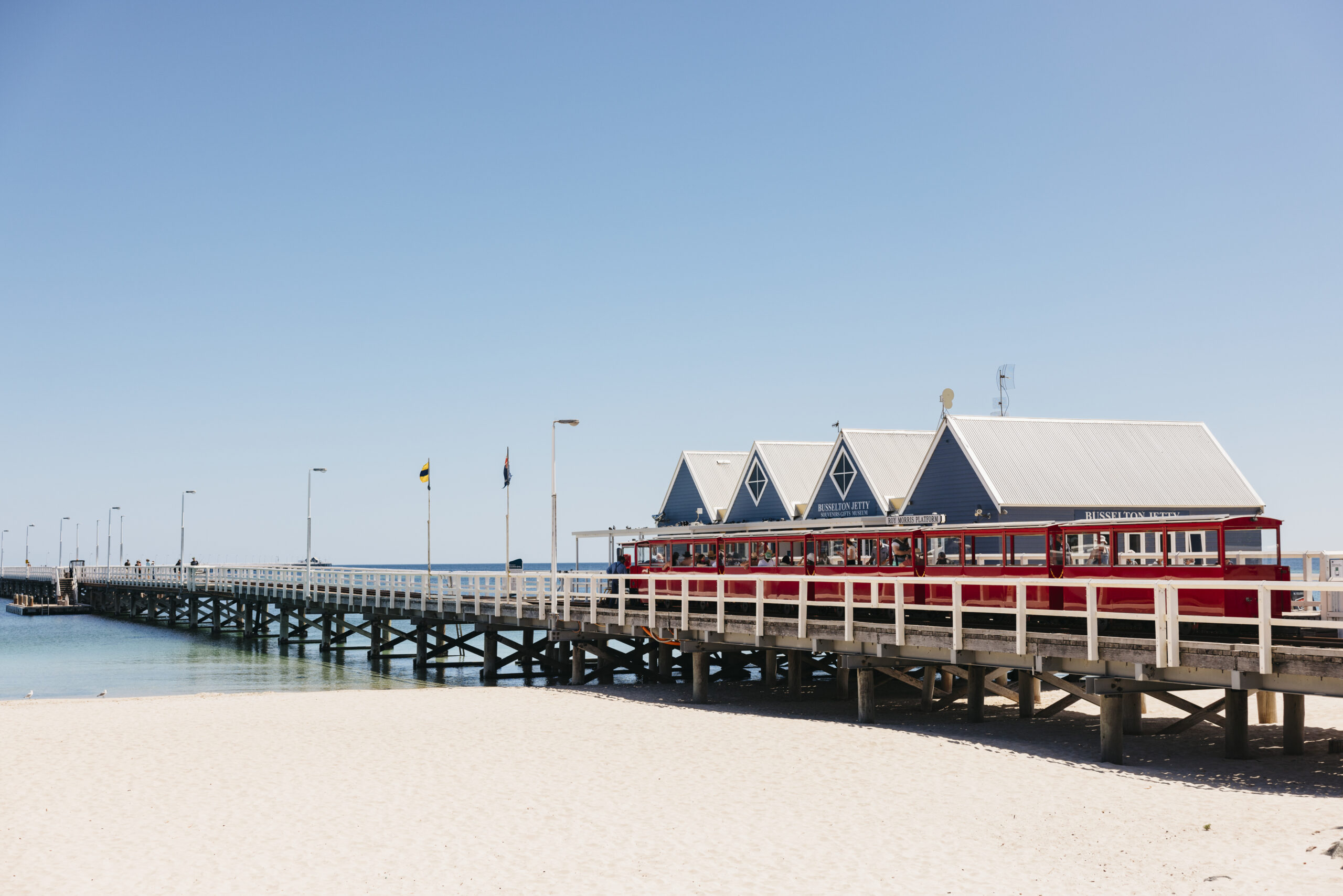 Busselton Jetty extending over turquoise water under a blue sky in Geographe Bay, Western Australia. Kalbarri to Margaret River Tour