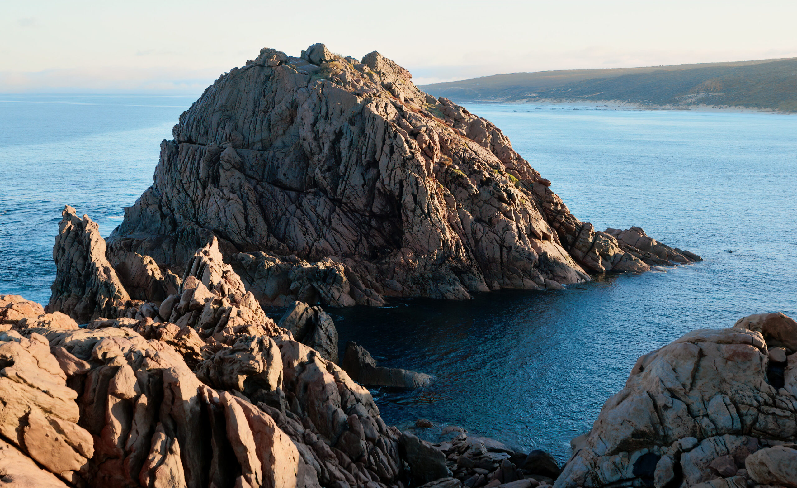 Rugged granite rocks surrounded by blue ocean at Canal Rocks near Yallingup in Western Australia’s South West region.