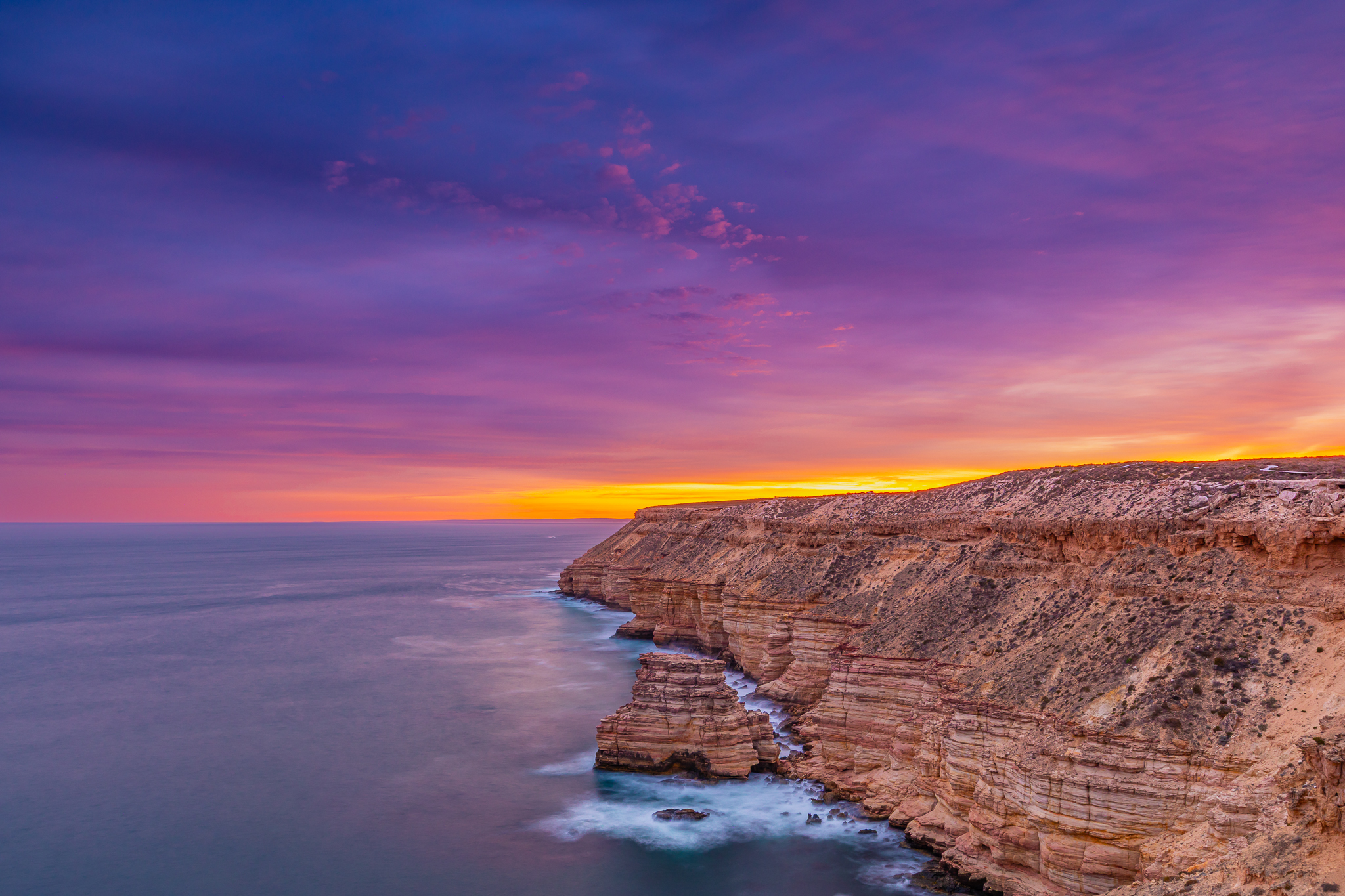 Sunset over the rugged coastal cliffs of Kalbarri overlooking the Indian Ocean in Western Australia